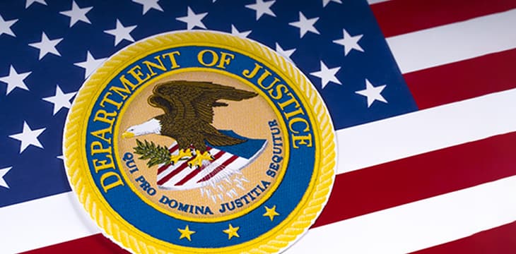 United States Department of Justice logo over US flag.