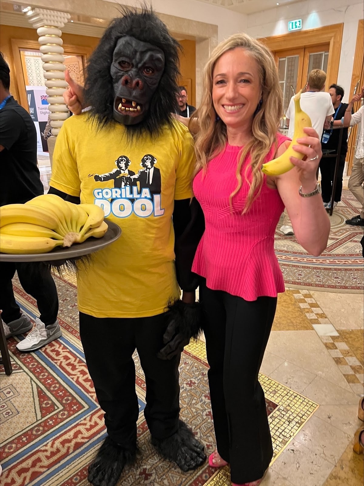 a mascot to hand out about 150 pounds of fresh bananas