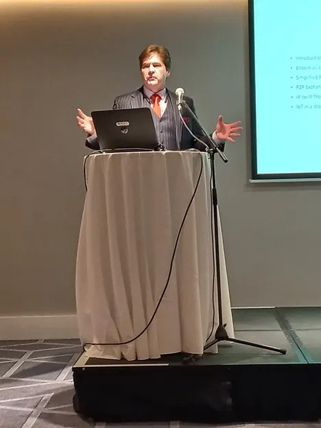 Dr. Craig Wright on stage at Global IoT summit in Dublin