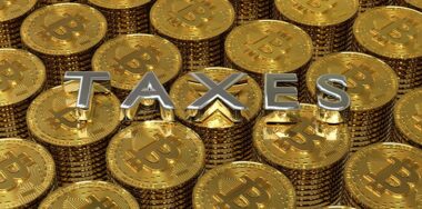3D render image of a pile of coins with the text taxes