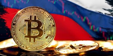 Cryptocurrency standing in front of Blurred Russia flag.