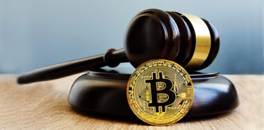 Crypto regulation. Gavel and cryptocurrency.