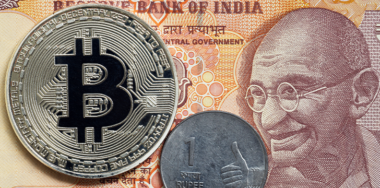 Golden bitcoin and indian rupee money.