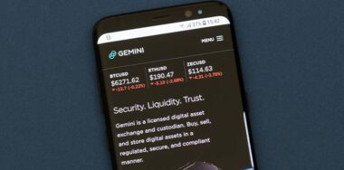 Gemini webpage displayed on the smartphone screen. Gemini is a digital currency exchange and custodian that allows customers to buy, sell and store digital assets