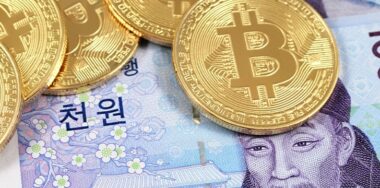 Bitcoins with South Korean won banknote