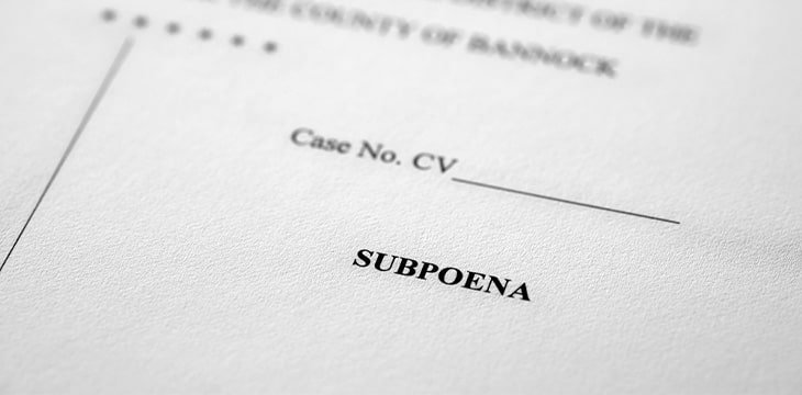 court paper with subpoena written