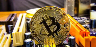 Cryptocurrency Bitcoin On The Motherboard. Gold Coin. Virtual Currency