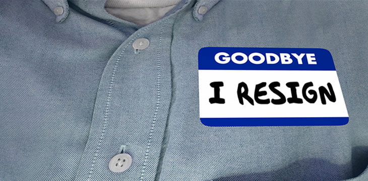 Goodbye I Resign Name Tag on a light blue collar shirt