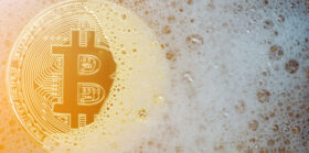 Golden bitcoin in a soap bubble
