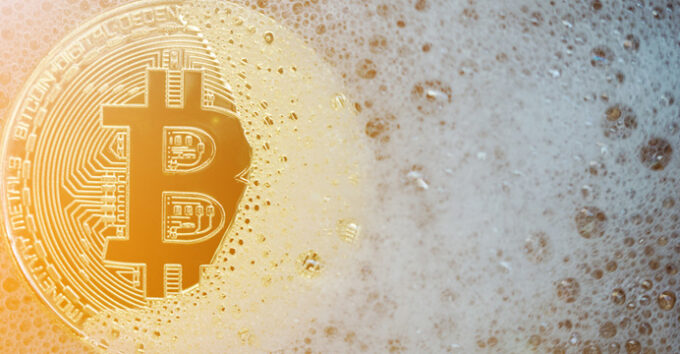 Golden bitcoin in a soap bubble