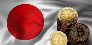 Bitcoin coins on Japanese flag