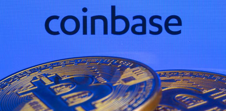 Coinbase logo and Bitcoins — Stock Editorial Photography