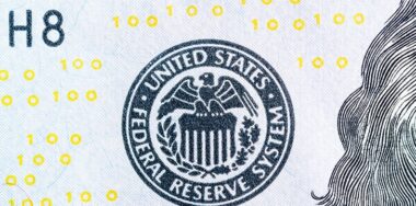 Federal reserve system symbol on hundred dollar bill closeup