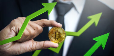 Businessman Holding Bitcoin With Green 3D going up