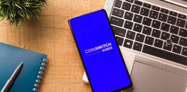 CoinSwitch Kuber logo on phone screen