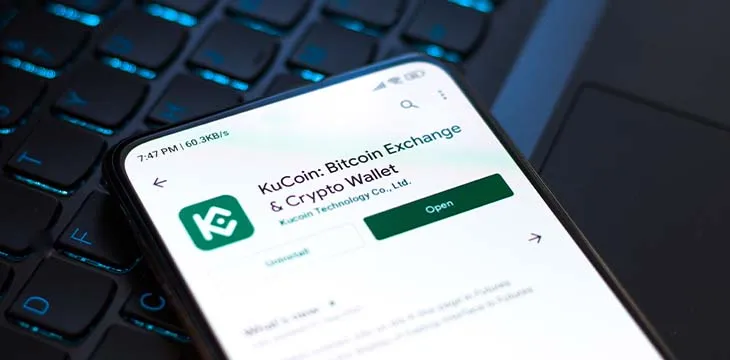 West Bangal, India - September 28, 2021 : Kucoin logo on phone screen stock image.