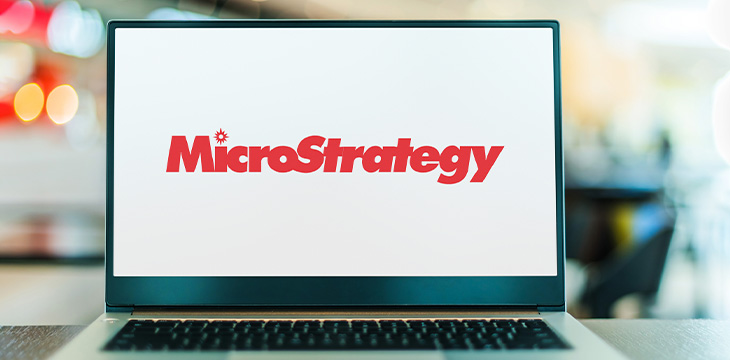 Laptop screen displaying logo of Microstrategy