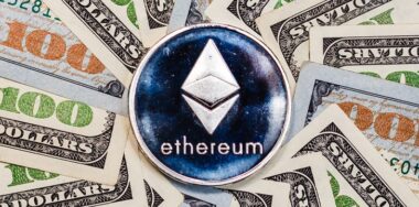 Ethereum crypto currency on dollar banknotes