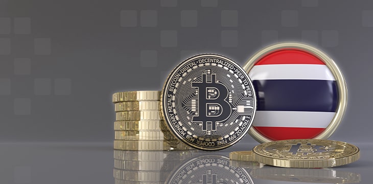 Bitcoin and Thailand Flag on table