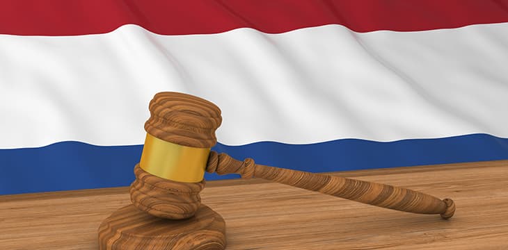 Dutch Law Concept - Flag of the Netherlands Behind Judge's Gavel.