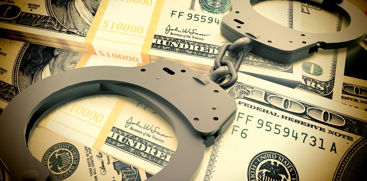Financial fraud concept with hand cuffs