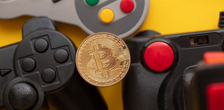 Crypto gaming concept. Video game controller with a bitcoin cryptocurrency coin