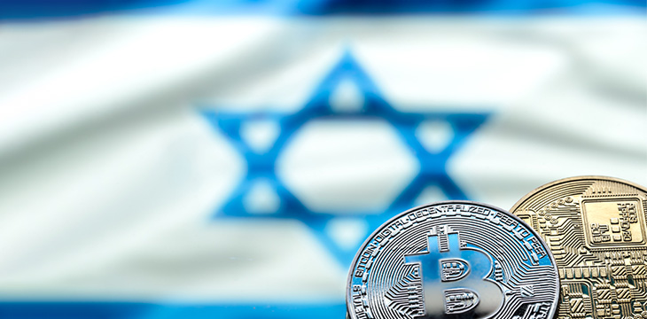 Bitcoin coins on the background of the Israeli flag, the concept of virtual money, close-up. Conceptual image of digital crypto currency