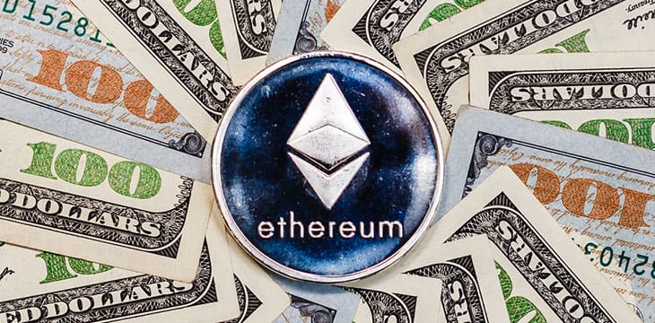 Ethereum crypto currency on dollar banknotes