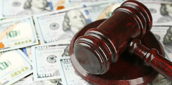 Gavel with money on background
