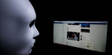 You never know who is behind your screen. Anonymous mask to hide identity in front of a computer - internet criminal and cyber security threat concept. — Photo