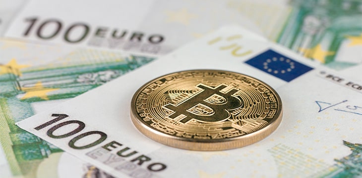 Cryptocurrency Bitcoin on European euro bills