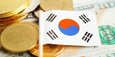 Stack of coins money with South Korea flag