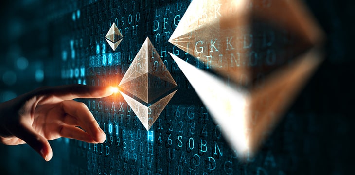 hand pointing to ethereum logo