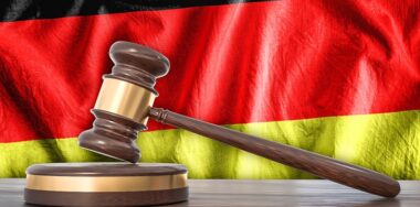Wooden gavel and flag of Germany