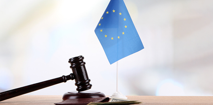 Gavel, money, passport and flag of Europe on wooden table