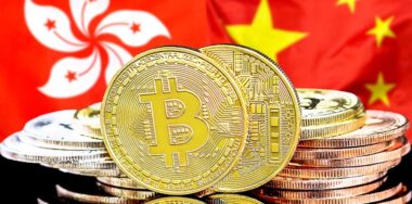 bitcoins in front of the flags of Hong Kong and China