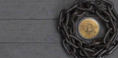 Bitcoin placed in the center of chain with lock