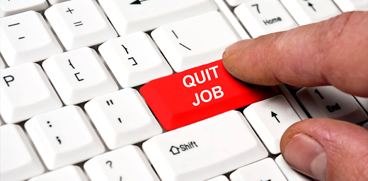 male finger pressing quit job key