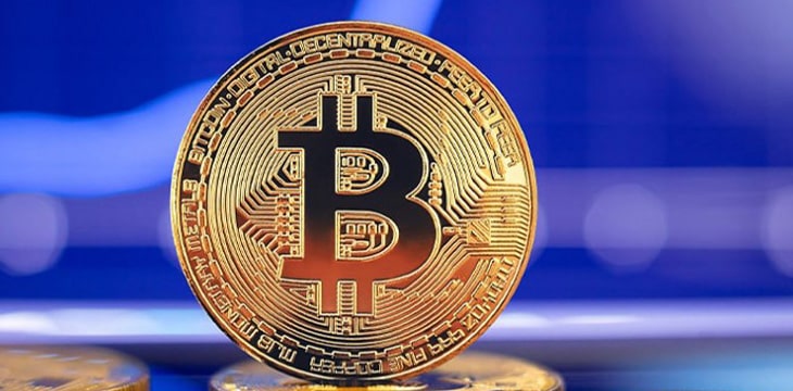 Bitcoin coin with blue background