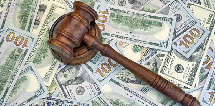Judges Or Auctioneer Gavel On The Dollar Cash background
