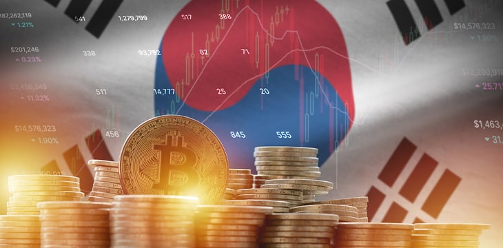 bitcoins in front of South Korean flag