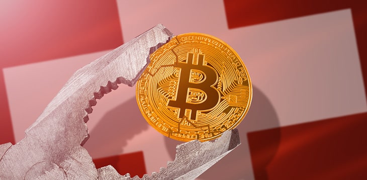 Pliers holding bitcoin in front of Switzerland flag