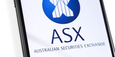 Closeup smartphone with ASX logo on the screen