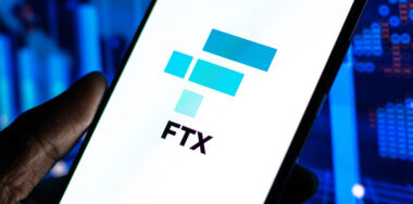 FTX logo on phone screen stock image