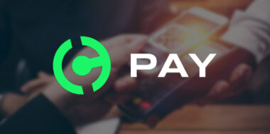 Handcash Pay Logo over paying with QR Code scene