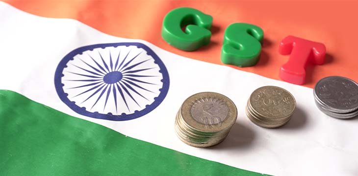 GST concept, GST alphabet and indian coins on Indian Flag background, business and financial india. Investment Saving and Corruption. — Photo