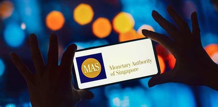 The Monetary Authority of Singapore (MAS) logo displayed on a smartphone screen.