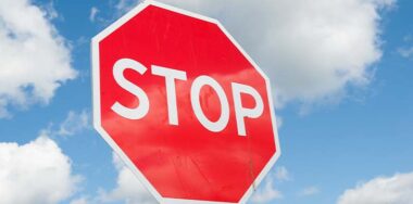 Stop sign over blue sky background — Photo