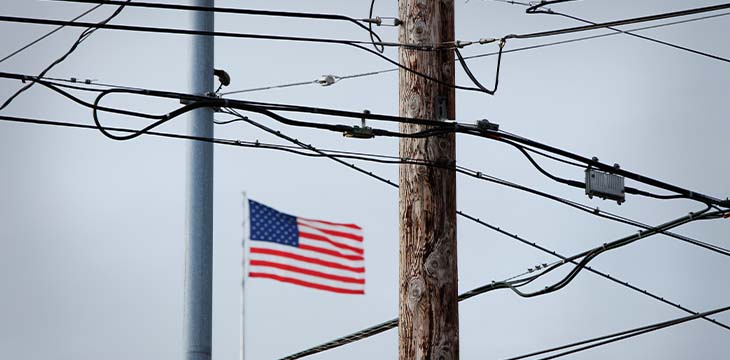 American Flag Behind Phone Wires And Electrical Wires — Photo