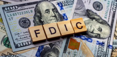 The word fdic on US dollar bills background